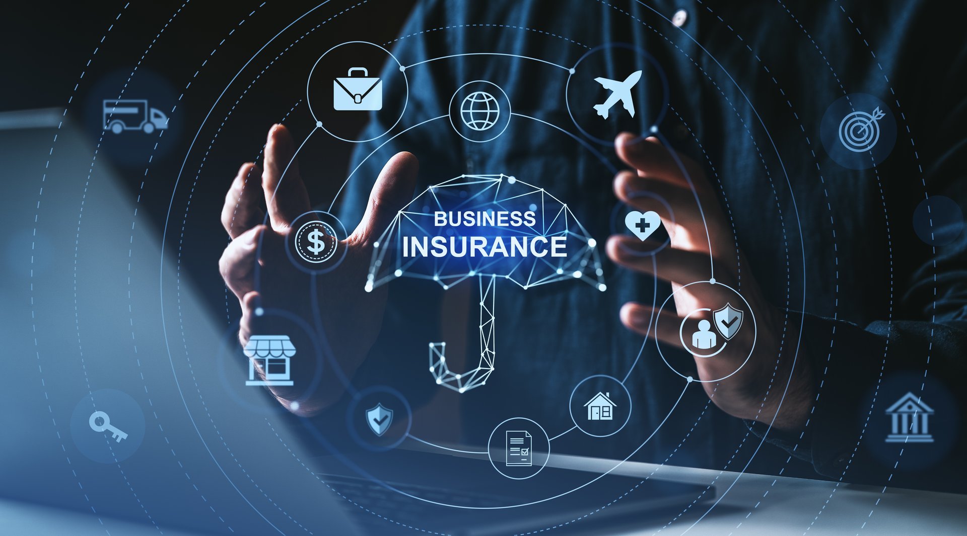Hands surrounding glowing umbrella labeled business insurance with various icons, digital style, on dark blurred background. Concept of commercial protection